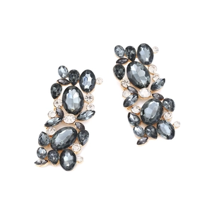 Close-up of vintage flower earrings with dark grey crystals and gold alloy setting
