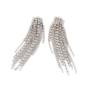 Macro shot of silver long fringe earrings with multi-layer sparkling crystal rhinestones