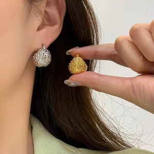 Textured hammered metal spherical hoop earrings in gold and silver plating