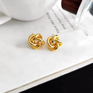 Polished gold knot earrings featuring a layered geometric twisted design for women
