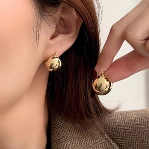Polished 18K gold ball hoop earrings for women featuring a minimalist elegant design