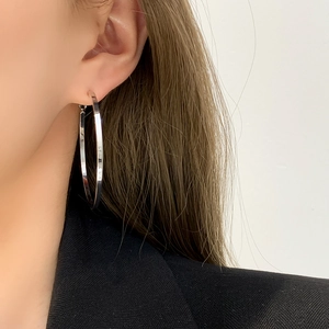 Polished silver large hoop earrings for women in a minimalist fashion design