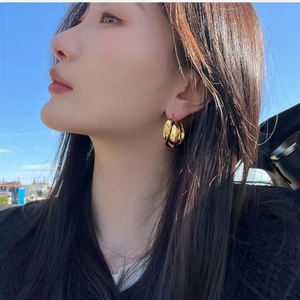 Chic triple layered gold hoop earrings with polished irregular geometric twist design