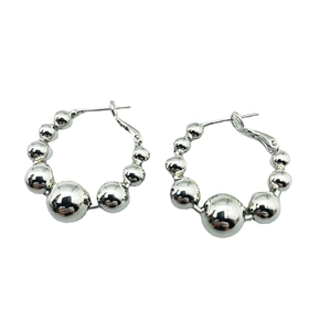 Minimalist silver beaded hoop earrings with gradient polished metal beads on white background