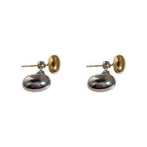 Minimalist 18K gold and silver two-tone bean stud earrings with polished mirror finish
