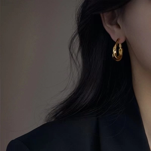 French style minimalist gold twisted hoop earrings with a luxury vintage metallic texture