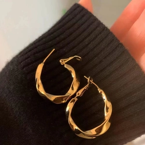 French retro gold twisted metal hoop earrings with high-polished elegant spiral design