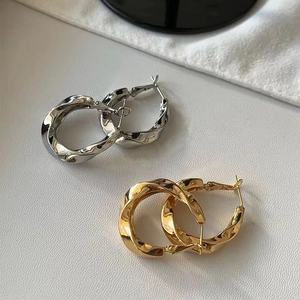 French minimalist vintage twisted metal hoop earrings in gold and silver finishes