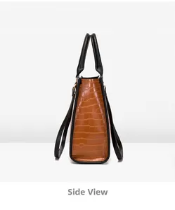 Vue latérale d'un sac cabas marron à motif crocodile en cuir synthétique structuré