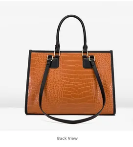 Vue détaillée du dos d'un cabas avec texture crocodile marron et anses noires