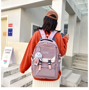 Lavender nylon backpack detail showing JIAYIBAG logo and cute plush bunny charm