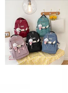 Detailed view of large capacity school backpacks in five colors with cute bunny charms