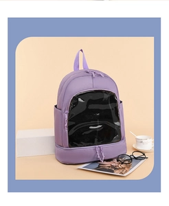 Detail of purple Oxford fabric backpack featuring a clear PVC window and layered storage