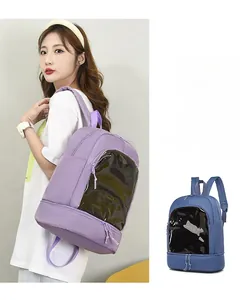Detail showing transparent front window and separate bottom compartment on travel backpack