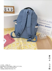 Close-up of Morandi blue waterproof nylon backpack featuring breathable padded shoulder straps