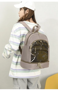 Detail of grey-purple Oxford backpack featuring a transparent PVC window for display