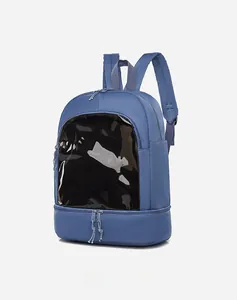 Close-up of blue nylon backpack with clear PVC window and bottom zipper compartment