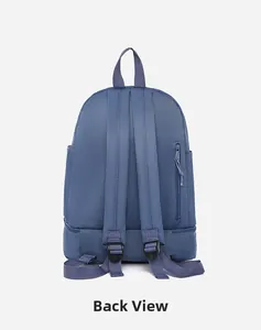 Detail view of the back of blue oxford fabric backpack with ergonomic straps and hidden zip