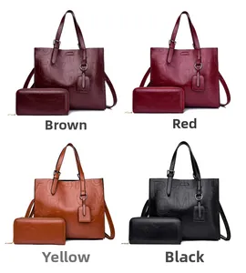 Set of large capacity embossed tote bags and matching wallets in four distinct colors