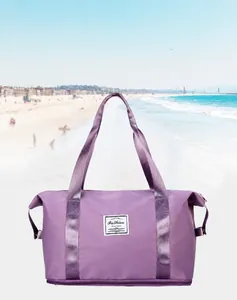 Close-up of lavender waterproof nylon travel bag with Fashion label and side buckle details
