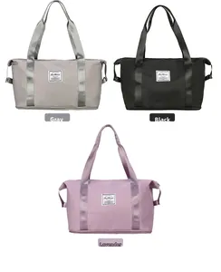 Detailed view of fashion travel bags in grey, black, and purple waterproof nylon