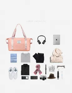 Flat lay of pink travel duffel bag with large capacity for clothes and electronics