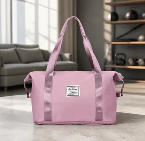 Detail view of taro purple travel bag with durable handles and fashion label detail