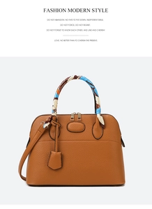 Brown lychee leather tote bag featuring a blue floral scarf wrapped handle and gold hardware