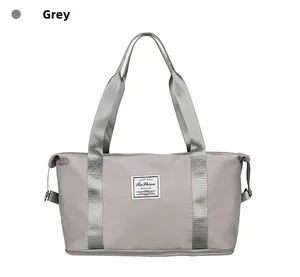 Macro shot of grey water-resistant nylon travel bag with shoe compartment and reinforced handles