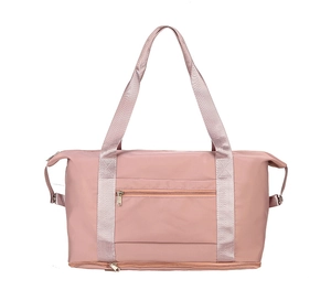 Detail view of pink travel bag with separate bottom shoe compartment and waterproof fabric