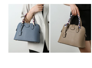 Close-up of litchi grain leather dome handbags with decorative silk-wrapped handles