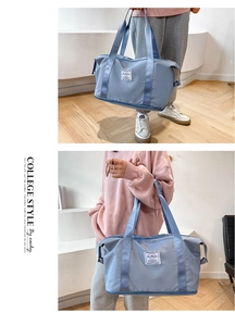 Detail of light blue waterproof fitness bag with wide handles and Fashion woven label