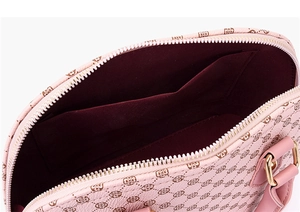 Interior view of pink shell bag with clover print and burgundy lining details