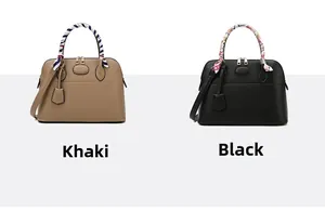 Detail of khaki and black leather tote bags with silk scarf handles and gold hardware