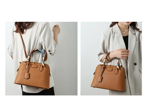 Detail of brown lychee grain leather handbag with silk scarf on handle and shoulder strap