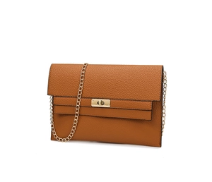 Close-up of brown pebbled leather envelope bag with gold twist lock and fine chain strap