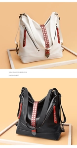 Détail du sac hobo avec bandes de rivets rouges et cuir grainé en noir et blanc