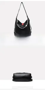 Vue détaillée du sac en cuir noir avec détails zippés rouges et boucle de sangle métallique