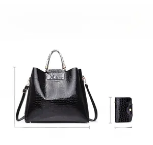 Detail view of black crocodile pattern tote set with precise dimensions and snake print handles