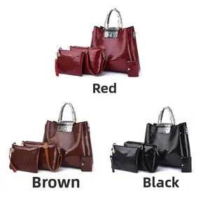 Detailed set of four synthetic leather bags with crocodile texture in red brown and black