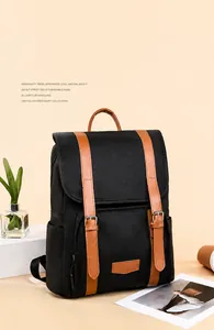 Detail of casual backpack with high-density nylon and brown faux leather buckles