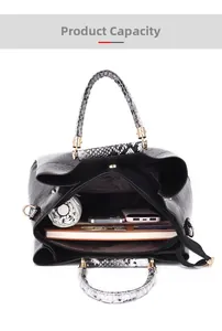 Internal capacity view of black embossed tote bag with snakeskin texture handles