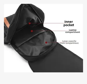 Internal compartments of the black nylon backpack showing laptop sleeve and large main bag