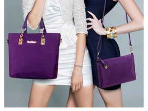 Purple nylon tote and crossbody bag set with gold hardware and brand detail