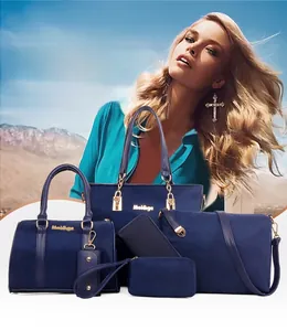 Detail showing 6-piece navy blue nylon handbag set with gold zippers and hardware accents