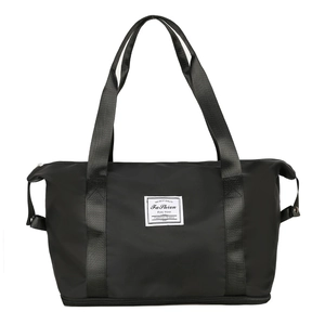 Large capacity black travel duffel bag made of waterproof nylon for sports and fitness