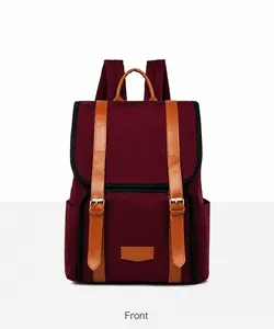 Front view of a burgundy nylon backpack with brown leather straps and metal buckle details
