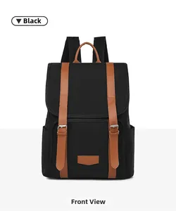 Front view of a lightweight vintage black backpack with brown leather strap accents