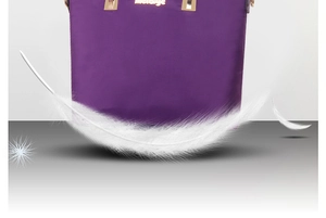 Detailed close-up of purple nylon handbag with gold metal accents and white feather