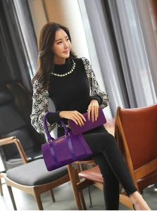Detail of purple nylon tote bag and matching long zipper wallet set for women